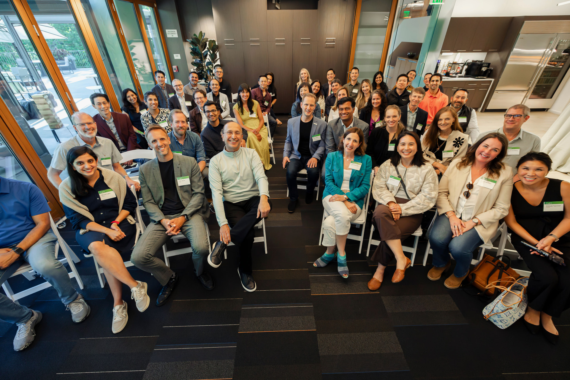Large group photo of attendees at a venture community gathering
