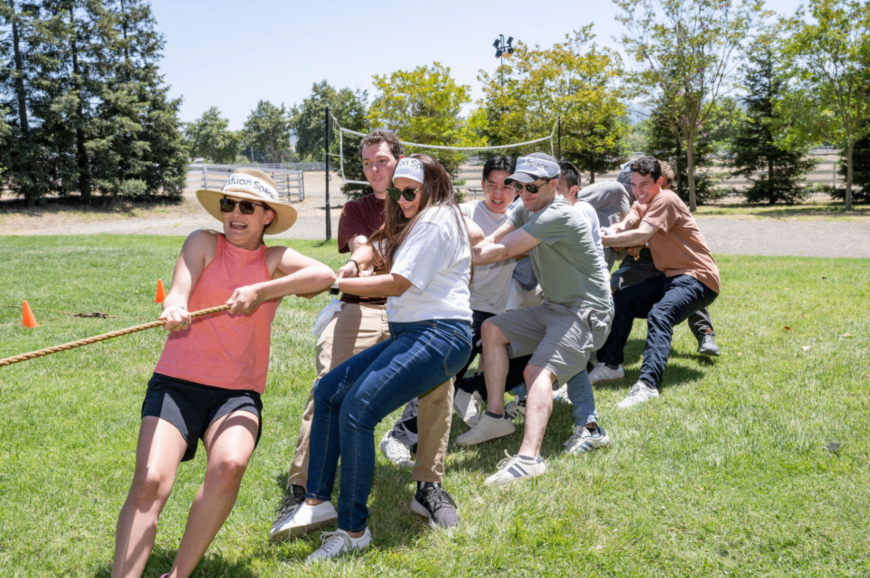 Team tug-of-war on a sunny field